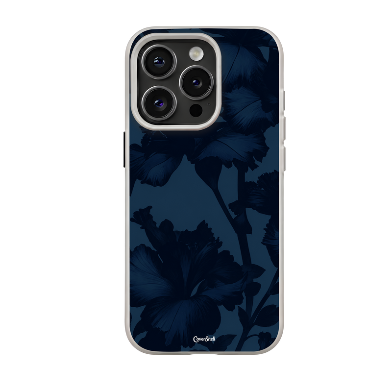 Midnight Bloom premium iPhone case featuring deep navy-blue hibiscus flowers on a dark monochromatic background with a light-colored bumper — CoverShell.